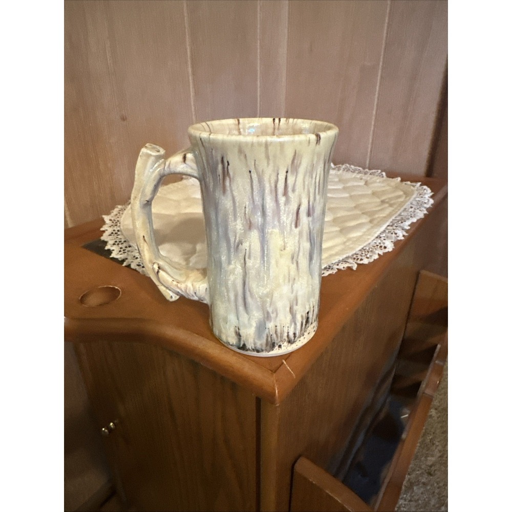 handmade studio pottery mug styled to look like a tree or birch Bark Signed